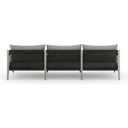 Sherwood Outdoor Sofa, Weathered Grey by Four Hands. Made from 100% olefin, solid fsc®-certified teak, 100% polypropylene in a coastal style.