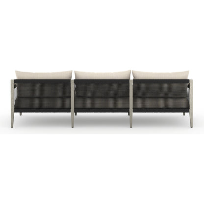 Sherwood Outdoor Sofa, Weathered Grey by Four Hands. Made from 100% olefin, solid fsc®-certified teak, 100% polypropylene in a coastal style.