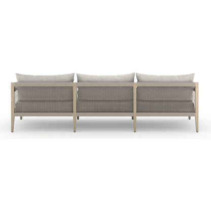 Sherwood Outdoor Sofa, Washed Brown by Four Hands. Made from 100% olefin, solid fsc®-certified teak, 100% polypropylene in a coastal style.