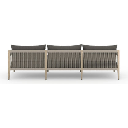 Sherwood Outdoor Sofa, Washed Brown by Four Hands. Made from 100% olefin, solid fsc®-certified teak, 100% polypropylene in a coastal style.