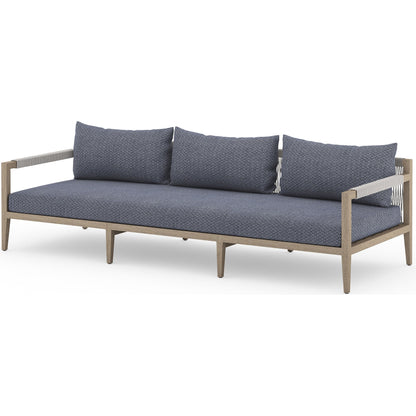 Sherwood Outdoor Sofa, Washed Brown by Four Hands. Made from 100% olefin, solid fsc®-certified teak, 100% polypropylene in a coastal style.