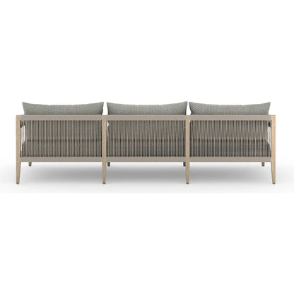 Sherwood Outdoor Sofa, Washed Brown by Four Hands. Made from 100% olefin, solid fsc®-certified teak, 100% polypropylene in a coastal style.