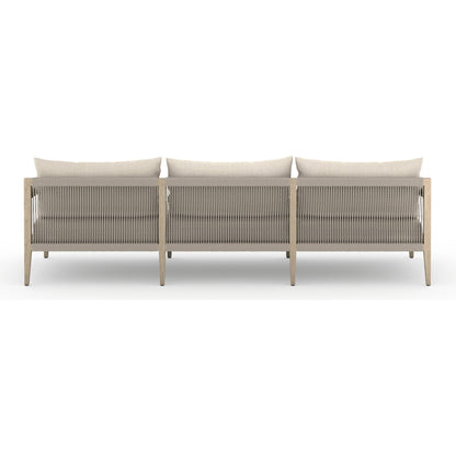 Sherwood Outdoor Sofa, Washed Brown by Four Hands. Made from 100% olefin, solid fsc®-certified teak, 100% polypropylene in a coastal style.