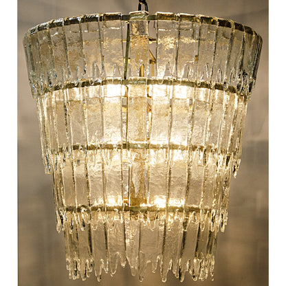 Bruna Chandelier by Noir in antique brass. Made from metal in a modern style.