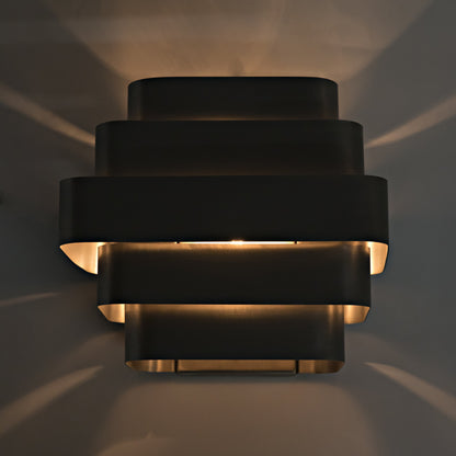 Baas Sconce by Noir in antique brass. Made from metal in a modern style.
