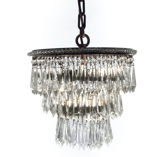 Ancil Chandelier by Zentique in copper hardware and crystal, copper. Made from crystal, copper in a traditional style.