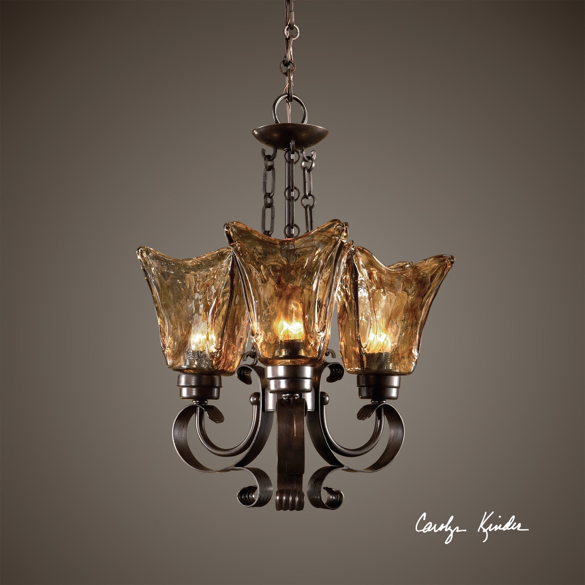 Vetraio Chandelier by Uttermost in bronze. Made from metal, brass, glass in a modern style.