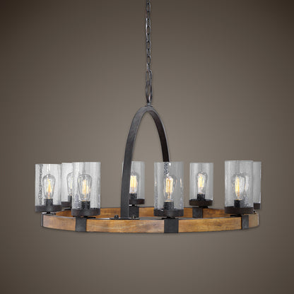 Atwood Wagon Wheel Pendant by Uttermost. Made from steel, rubber wood, glass in a rustic style.