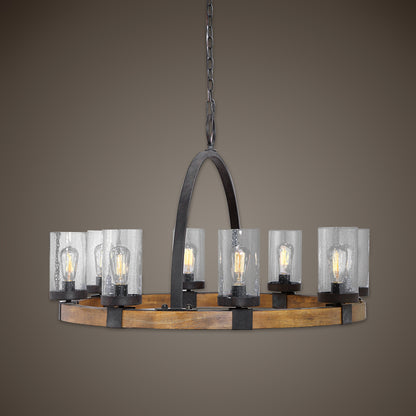 Atwood Wagon Wheel Pendant by Uttermost. Made from steel, rubber wood, glass in a rustic style.