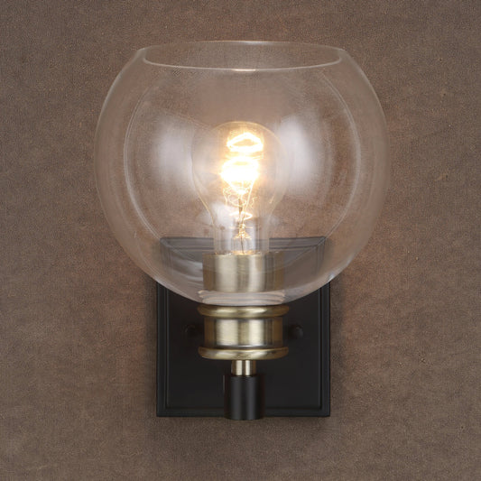 Kent Sconce by Uttermost in brass. Made from glass, steel in a transitional style.