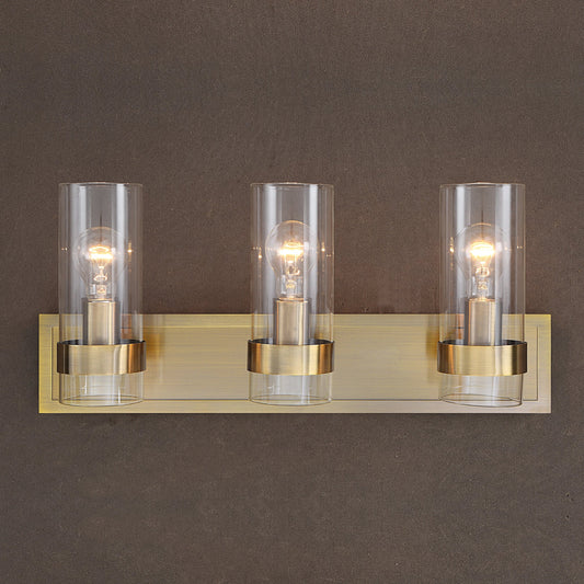 Cardiff Antique 3 Light Vanity by Uttermost in brass. Made from glass, steel in a modern style.