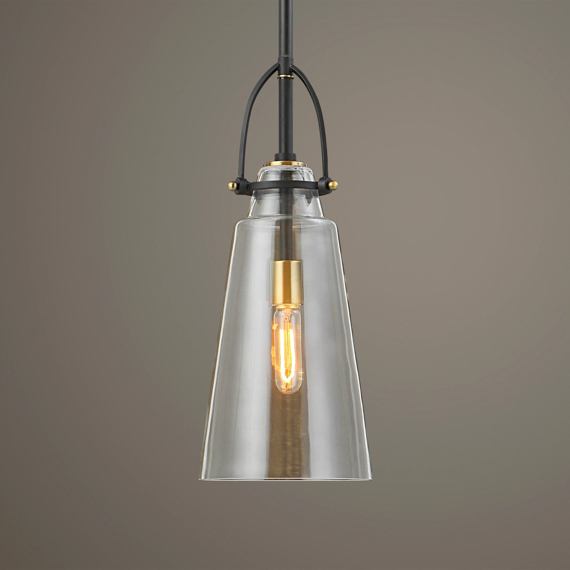 Saugus Pendant by Uttermost in brass. Made from steel, glass in a modern style.