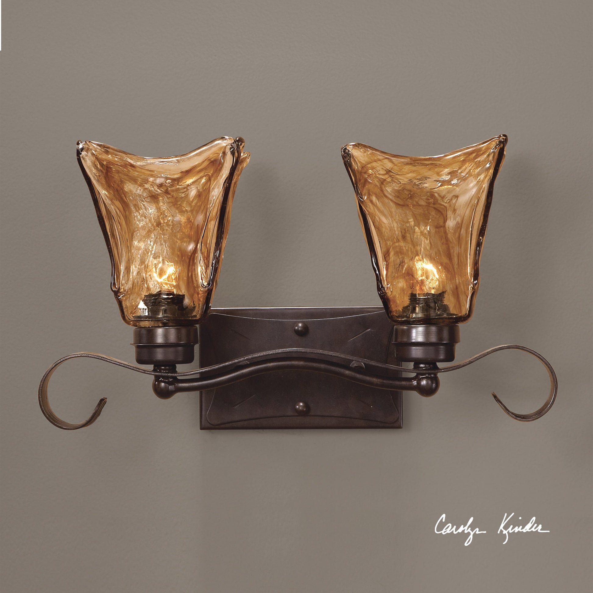 Vetraio Vanity Strip by Uttermost in bronze. Made from metal, brass, glass in a rustic style.