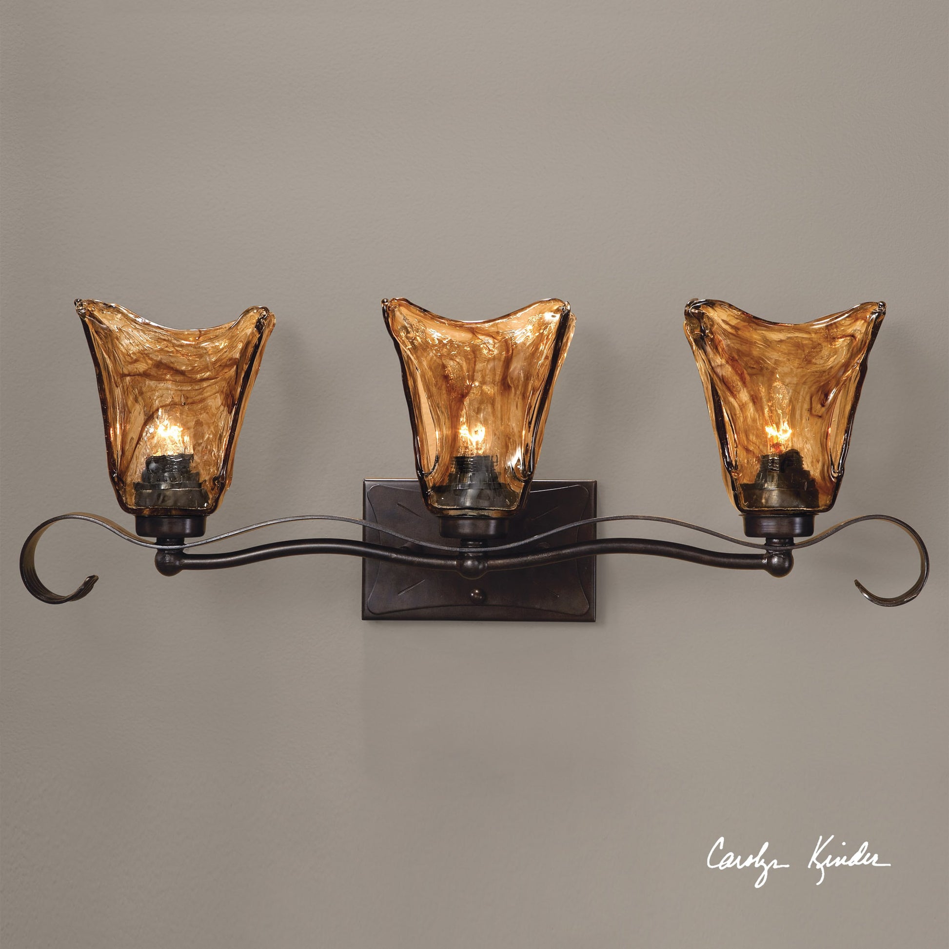 Vetraio Vanity Strip by Uttermost in bronze. Made from metal, brass, glass in a rustic style.