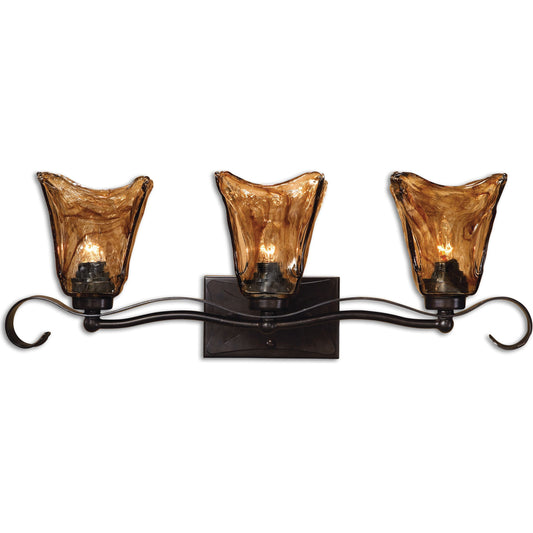 Vetraio Vanity Strip by Uttermost in bronze. Made from metal, brass, glass in a rustic style.