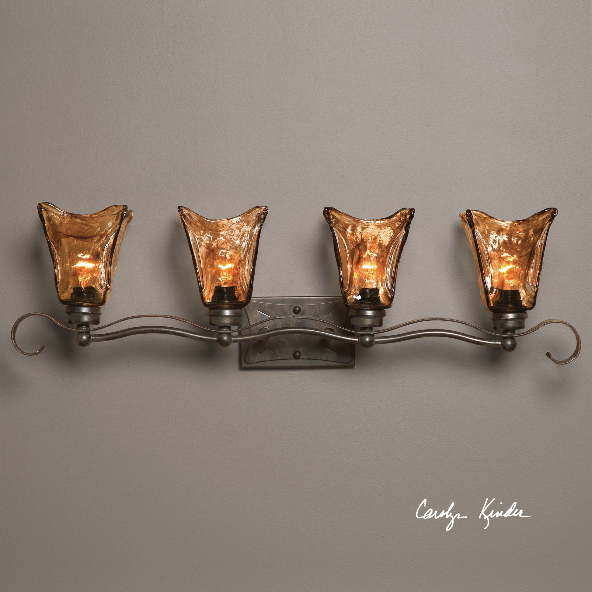 Vetraio Vanity Strip by Uttermost in bronze. Made from metal, brass, glass in a rustic style.