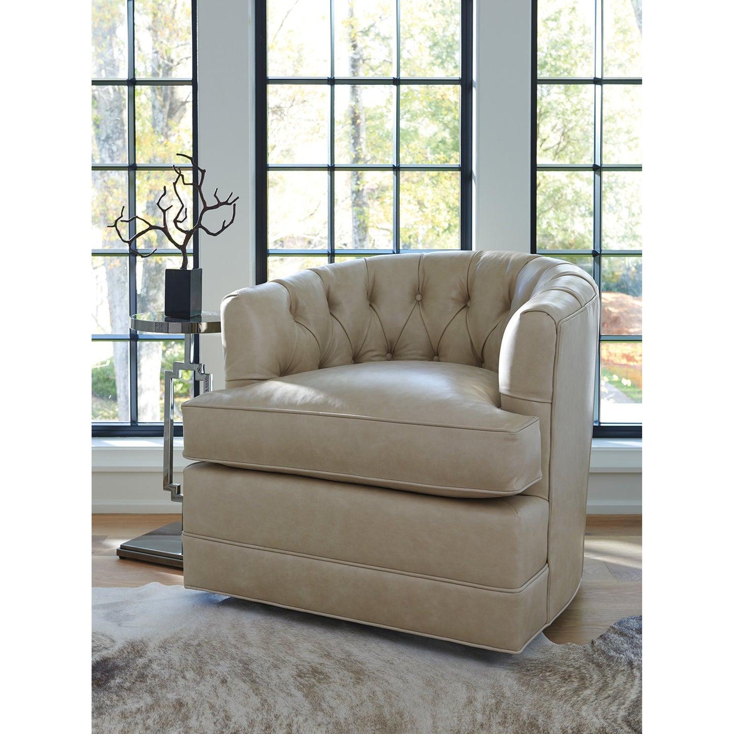 003 SR-834814 | Lifestyle | Cliffhaven Leather Swivel Chair by Barclay Butera in taupe. Made from unique in a traditional style.