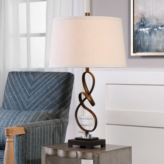Tenley Lamp by Uttermost in bronze. Made from steel, crystal in a modern style.
