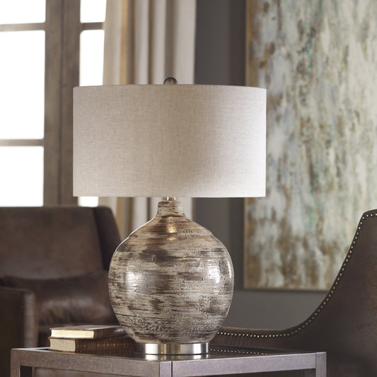 Tamula Distressed Ivory Table Lamp by Uttermost. Made from ceramic, iron in a modern style.