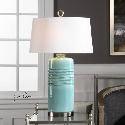Rila Distressed Teal Table Lamp by Uttermost. Made from ceramic, iron in a modern style.