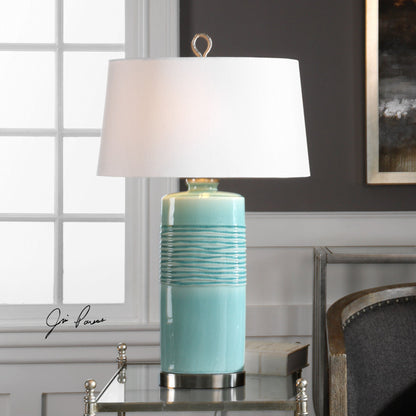 Rila Distressed Teal Table Lamp by Uttermost. Made from ceramic, iron in a modern style.