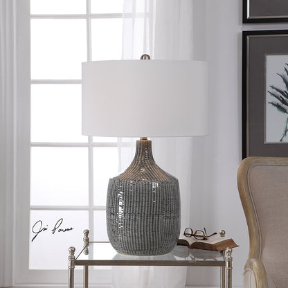 Felipe Table Lamp by Uttermost in light gray. Made from ceramic, iron, fabric in a eclectic & global style.