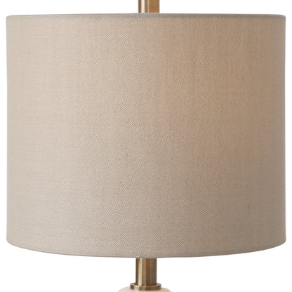 Natania Buffet Lamp by Uttermost in brass. Made from steel, marble, linen in a transitional style.
