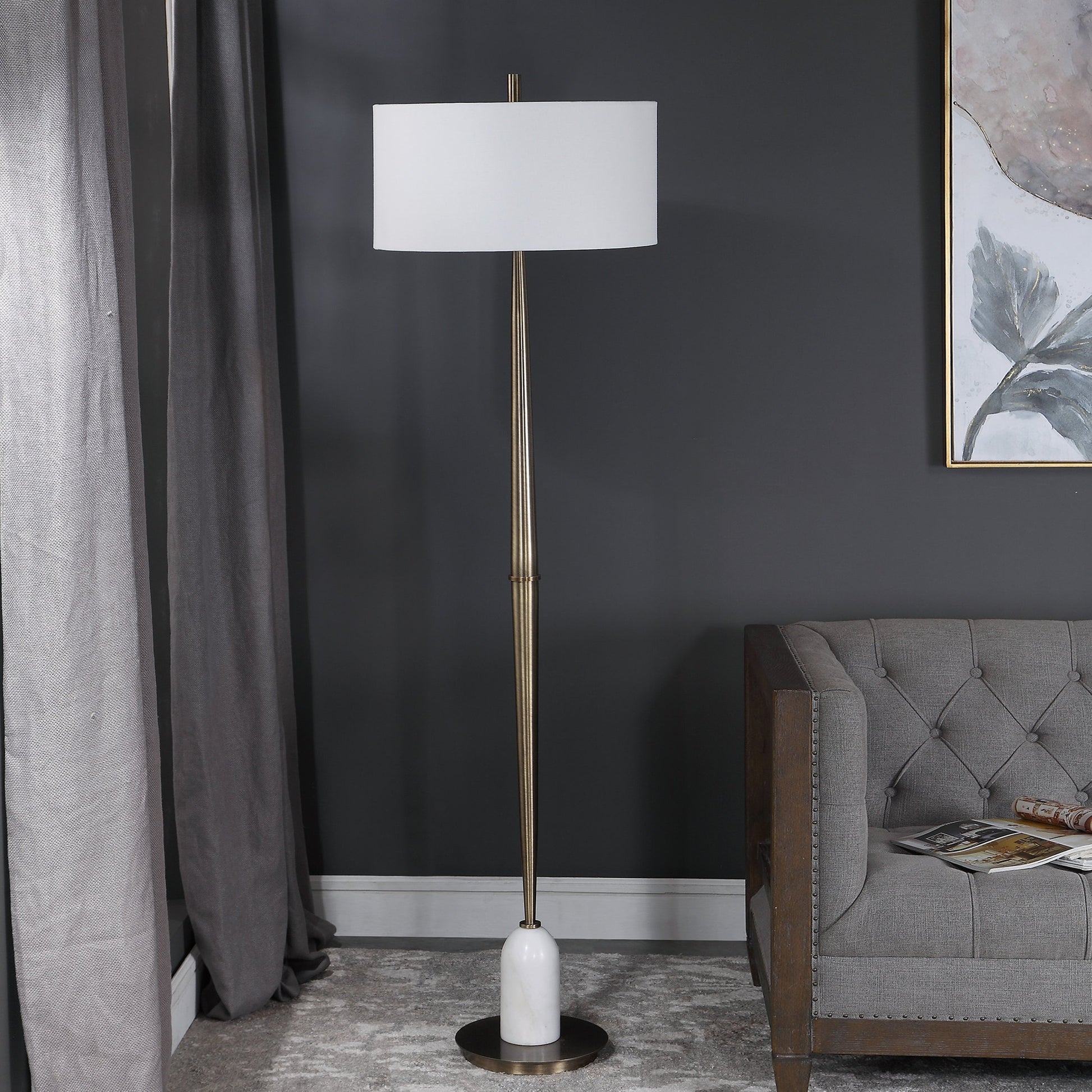 Minette Floor Lamp by Uttermost in antique brass. Made from steel, marble, fabric in a modern style.