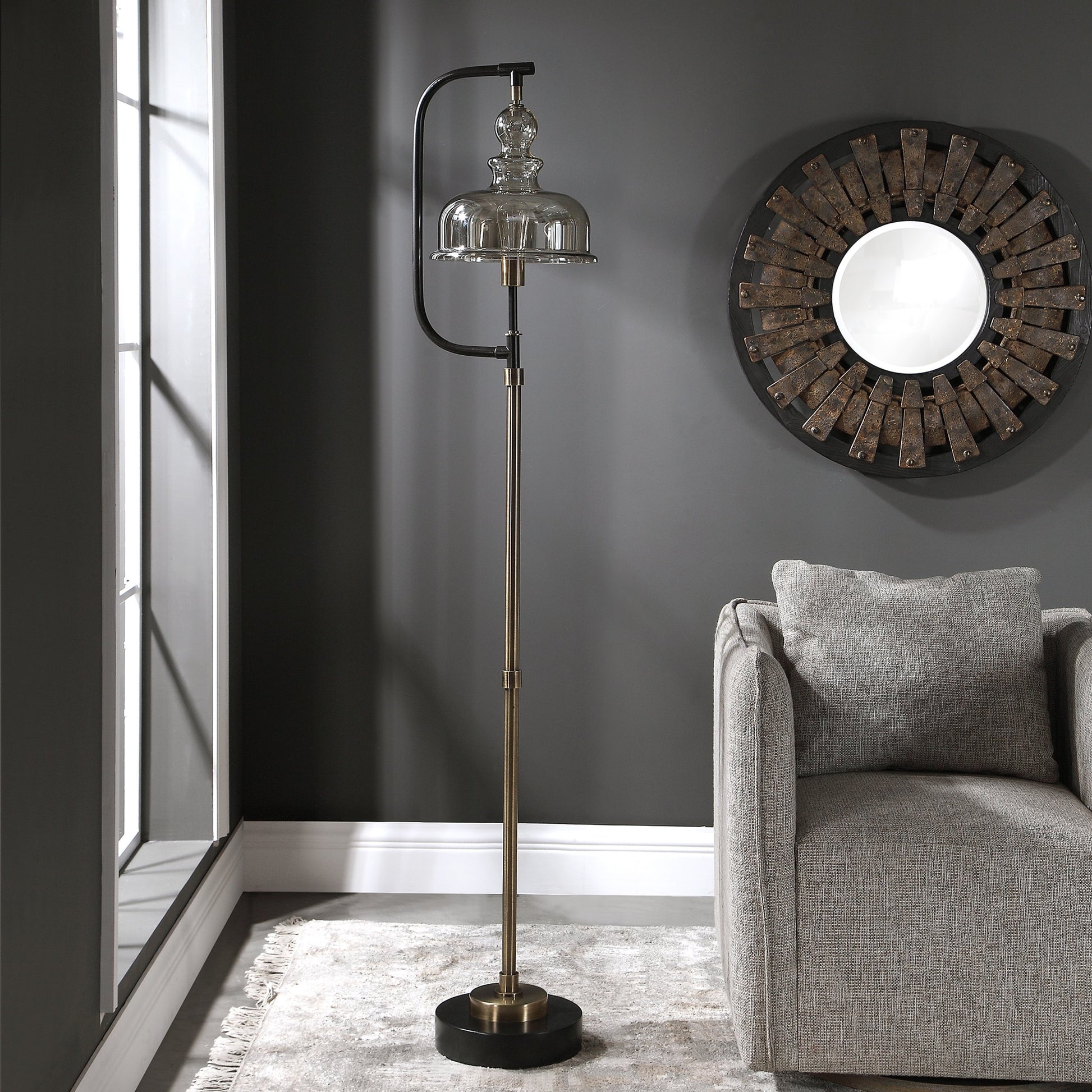 Elieser Floor Lamp by Uttermost in antique brass. Made from steel, glass in a modern style.