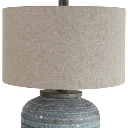 Pelia Table Lamp by Uttermost in aqua. Made from ceramic, resin, fabric in a coastal style.