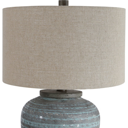 Pelia Table Lamp by Uttermost in aqua. Made from ceramic, resin, fabric in a coastal style.
