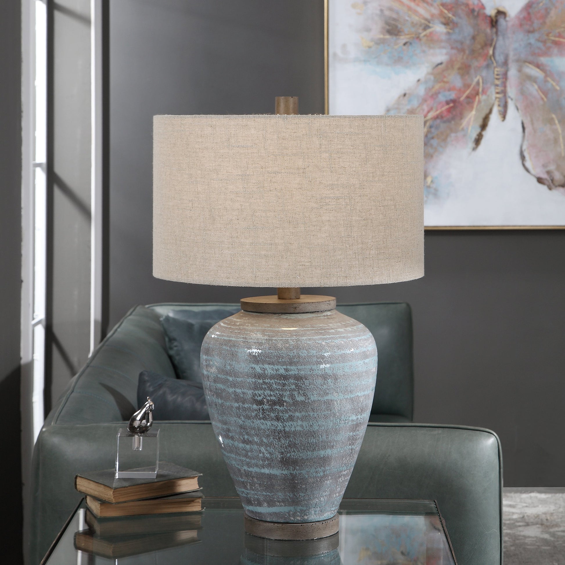 Pelia Table Lamp by Uttermost in aqua. Made from ceramic, resin, fabric in a coastal style.