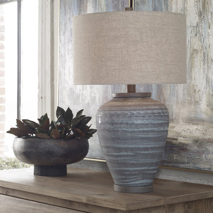 Pelia Table Lamp by Uttermost in aqua. Made from ceramic, resin, fabric in a coastal style.