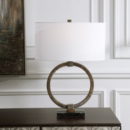 Relic Aged Table Lamp by Uttermost in gold. Made from resin, marble, iron, fabric in a eclectic & global style.