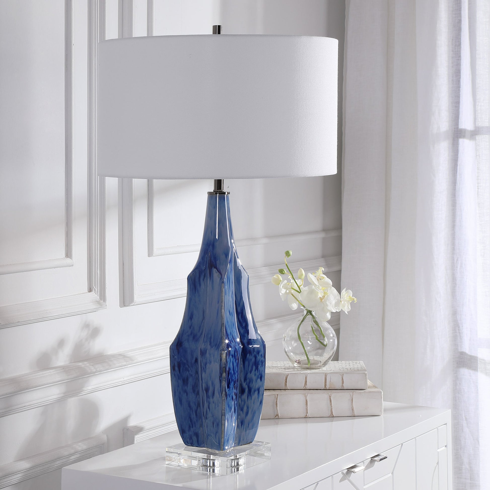 Everard Table Lamp by Uttermost in blue. Made from porcelain, crystal, iron, fabric in a modern style.