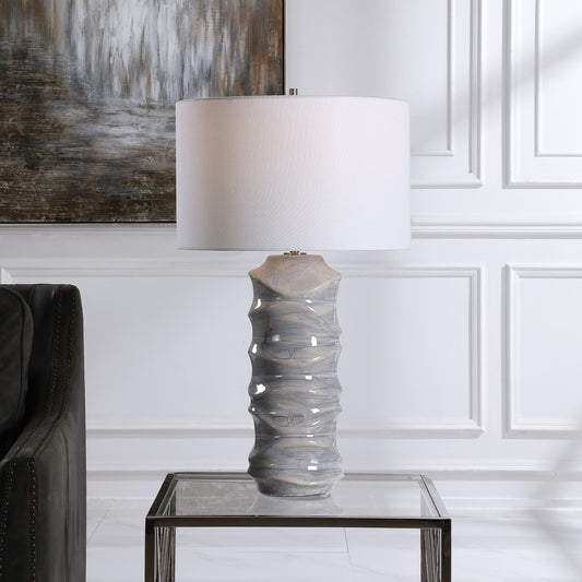 Waves Table Lamp by Uttermost in blue. Made from ceramic, iron, fabric in a modern style.
