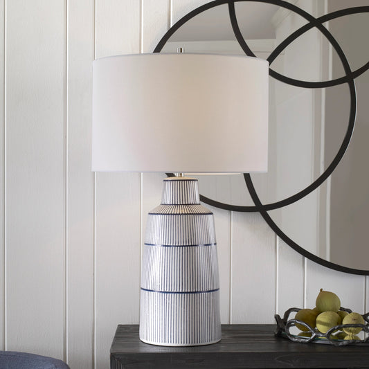 Breton Table Lamp by Uttermost in navy blue. Made from steel, ceramic, fabric in a coastal style.