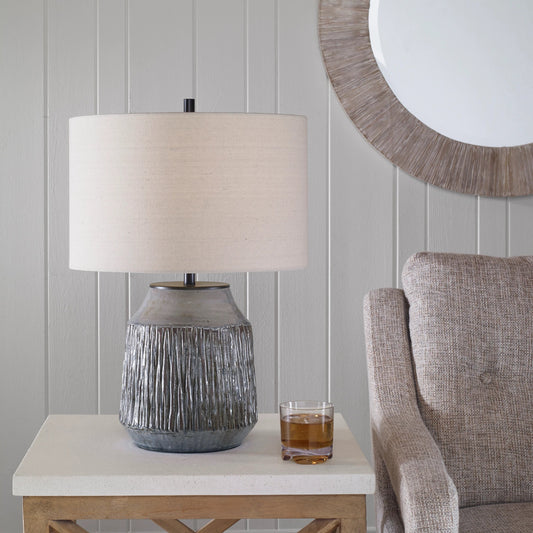 Neolithic Table Lamp by Uttermost in blue-gray. Made from steel, ceramic, fabric in a modern style.