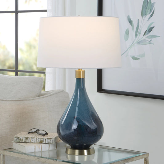 Riviera Lamp by Uttermost in sapphire, dark blue and brass. Made from steel, glass, fabirc in a modern style.