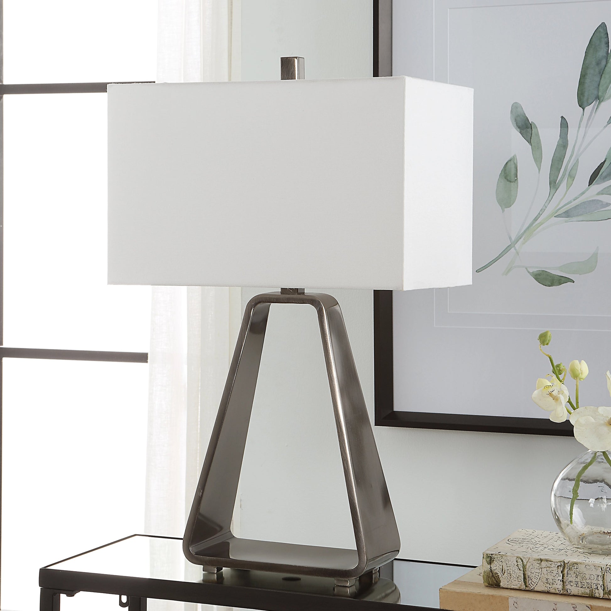 Halo Table Lamp by Uttermost in antique nickel. Made from steel, fabric in a modern style.