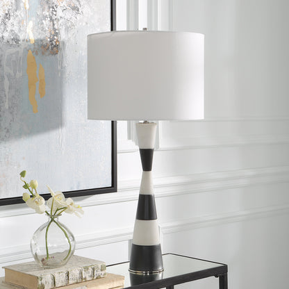 Bandeau Banded Table Lamp by Uttermost in black, white. Made from rice stone, iron, linen, resin in a modern style.