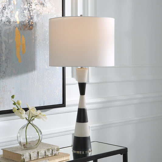 Bandeau Banded Table Lamp by Uttermost in black, white. Made from rice stone, iron, linen, resin in a modern style.