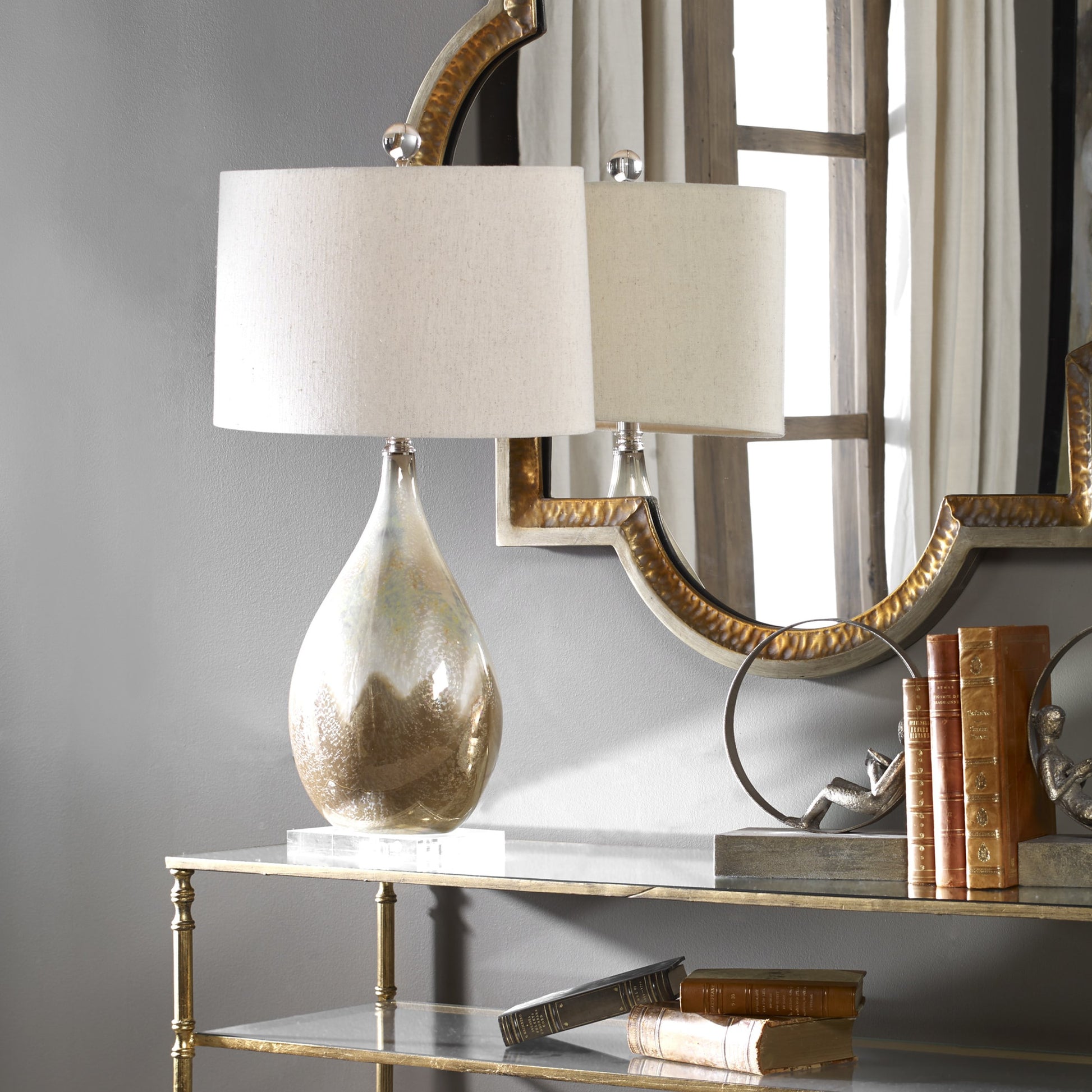 Flavian Glazed Ceramic Lamp by Uttermost. Made from crystal, ceramic in a modern style.
