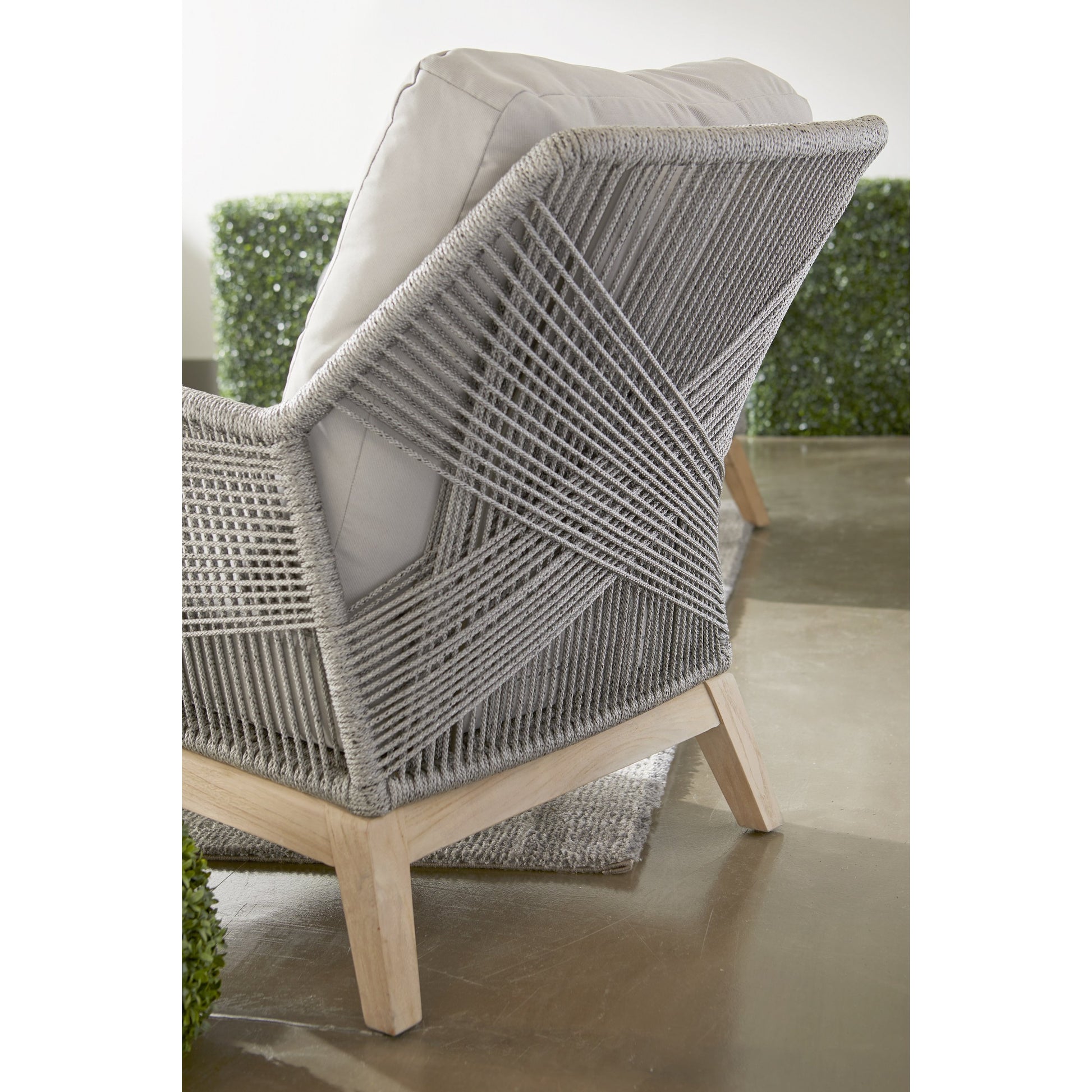 Loom Club Chair by Essentials For Living in gray teak, taupe, white flat rope, performance pumice. Made from solid teak wood, aluminum, 100% polyolefin rope, 100% olefin fabric, foam in a coastal style.