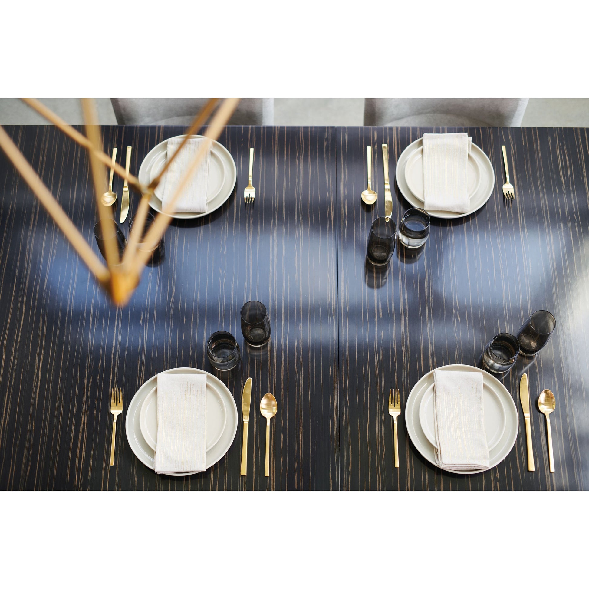 Edge Dining Table by Caracole in bronze, ebony and striated ebony, lucent bronze metallic paint. Made from asian hardwood, engineered ebony in a modern style.
