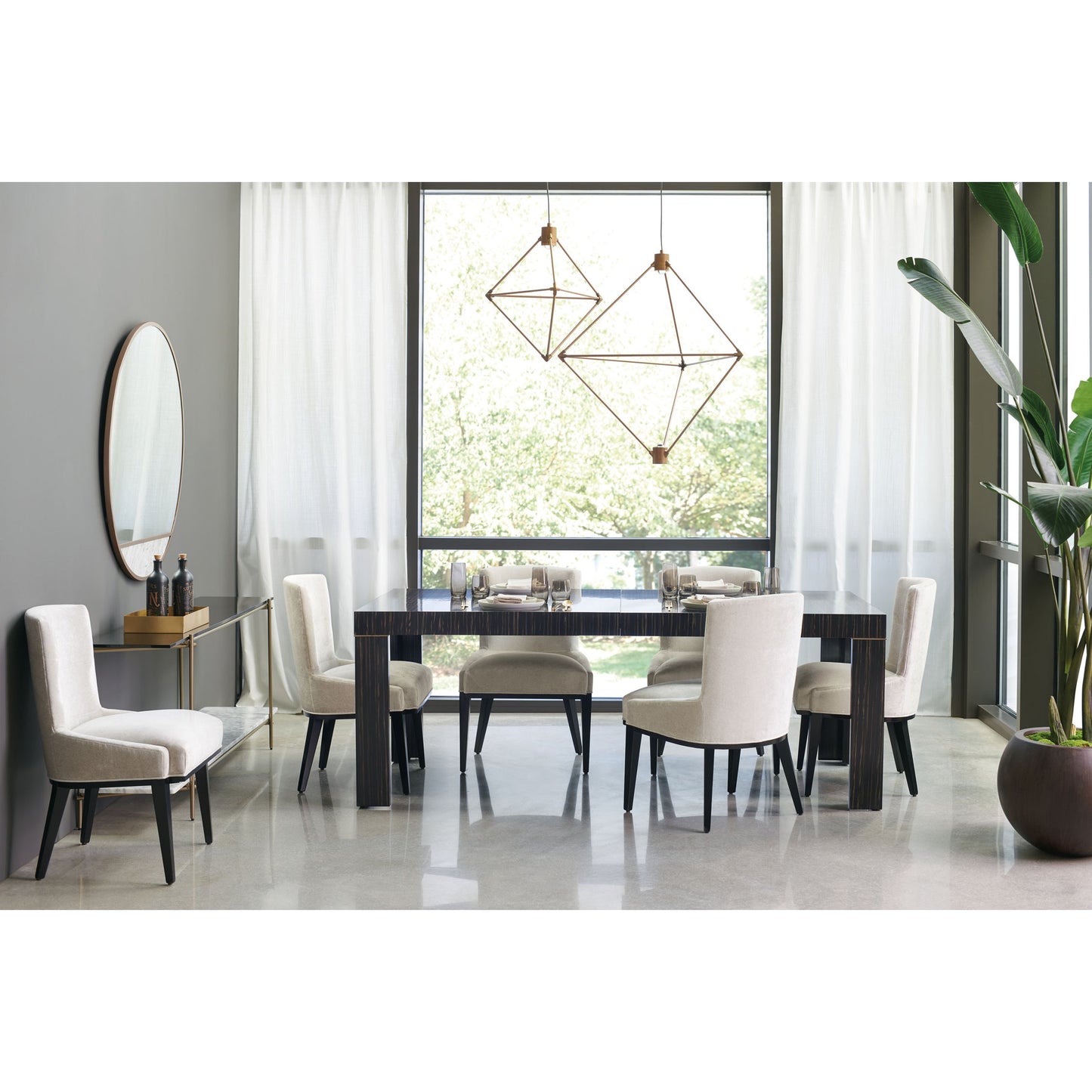 008 SR-770607 | Lifestyle | Edge Dining Table by Caracole in bronze, ebony and striated ebony, lucent bronze metallic paint. Made from asian hardwood, engineered ebony in a modern style.