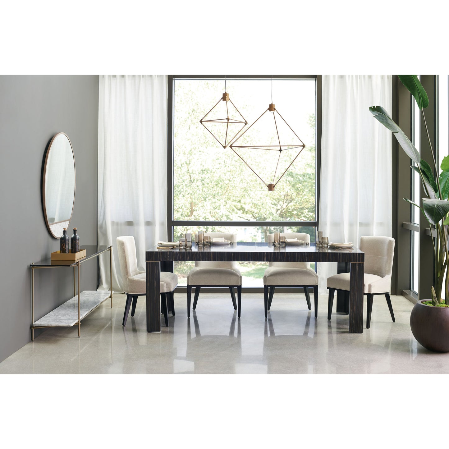 005 SR-770607 | Lifestyle | Edge Dining Table by Caracole in bronze, ebony and striated ebony, lucent bronze metallic paint. Made from asian hardwood, engineered ebony in a modern style.