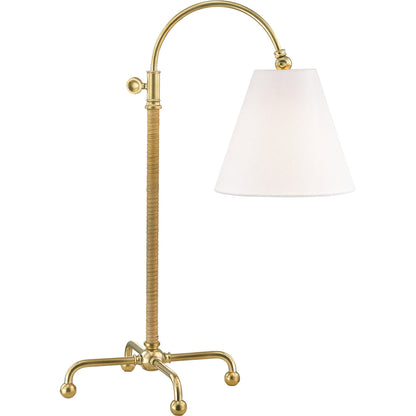 Curves NO.1 Floor Lamp W/ Rattan Accent by Hudson Valley in aged brass. Made from steel in a traditional style.
