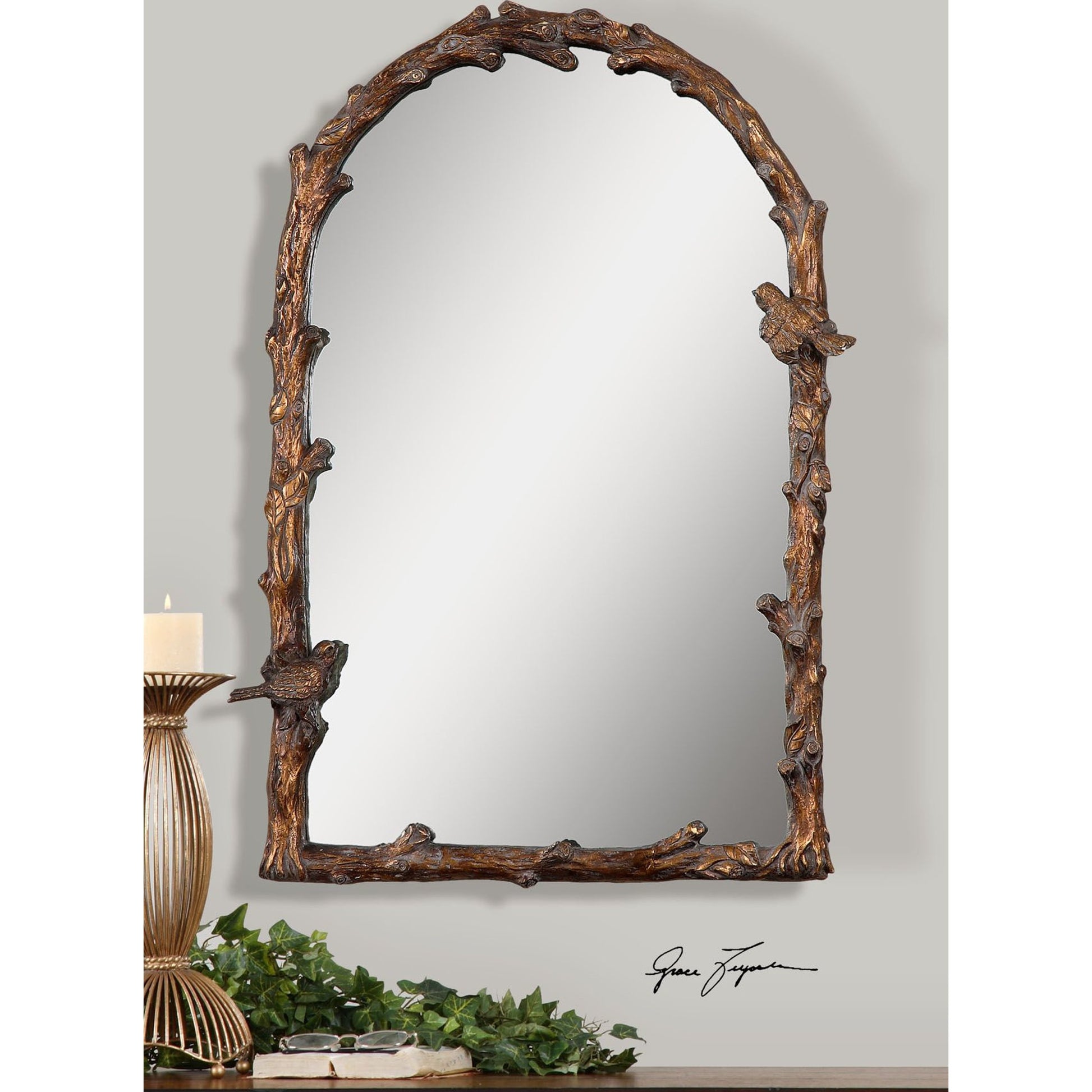Paza Arch Mirror by Uttermost in gold. Made from metal, resin in a cottage & farmhouse style.