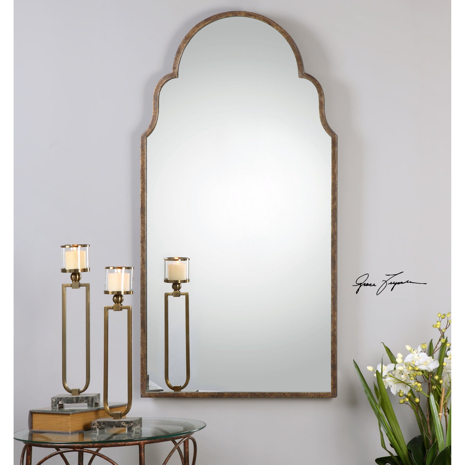 Brayden Tall Arch Mirror by Uttermost. Made from metal in a traditional style.